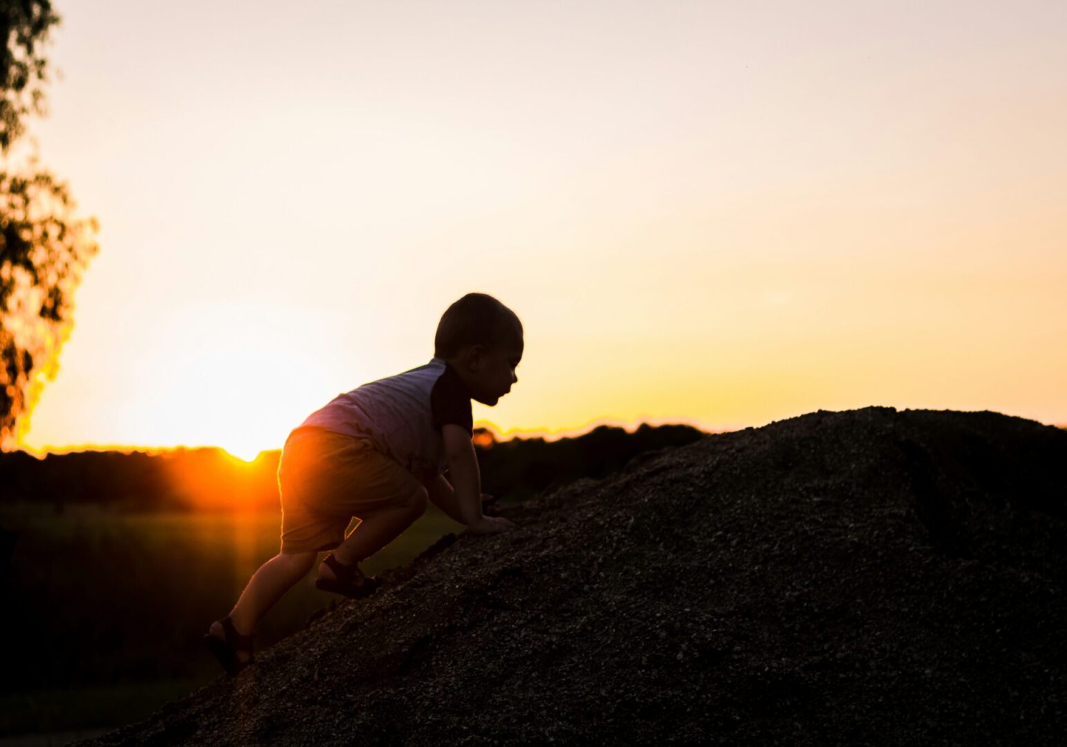 toddler climbing hill - leanna-cox-ukhn2gy9_CU-unsplash